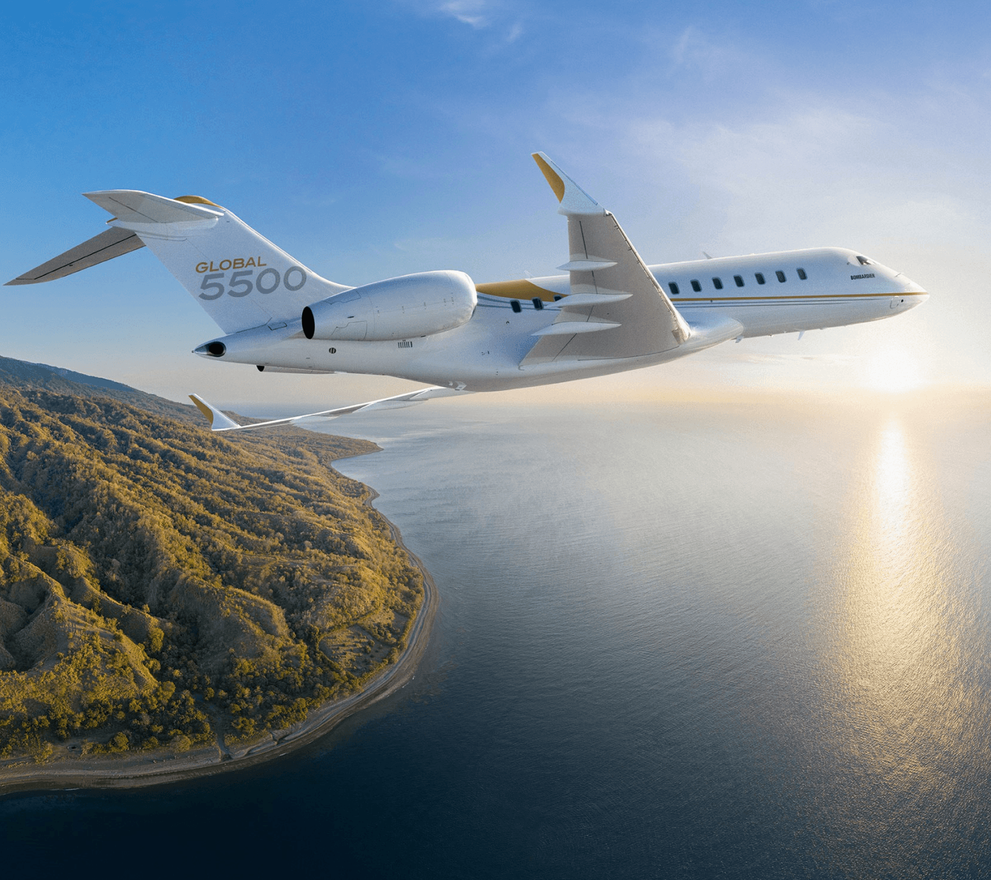 Private jet flying over the sea and mountains